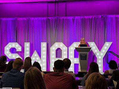 Kristy Dickinson delivering the opening keynote at the 2024 Swaay Conference
